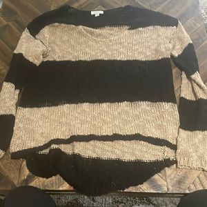 Black and tan knit top brand is charming Charlie size is women’s small